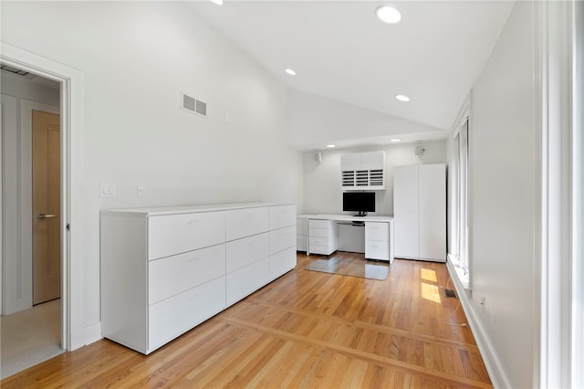 241 W Chapel Ridge Rd, Fox Chapel, PA 15238 - kitchen featuring vaulted ceiling, light wood-style floors, white cabinets, stainless steel dishwasher, and light countertops