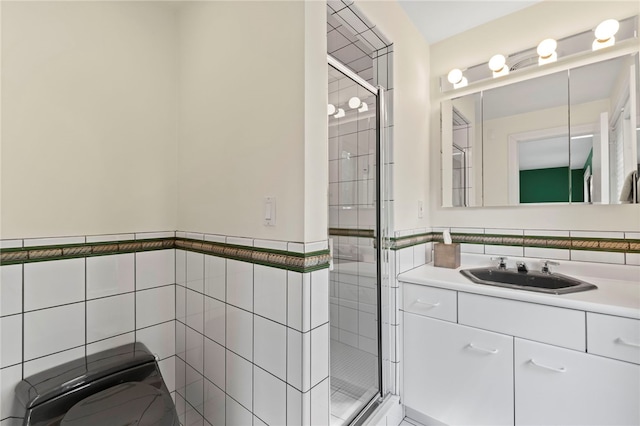 241 W Chapel Ridge Rd, Fox Chapel, PA 15238 - bathroom featuring tile walls, a stall shower, vanity, and wainscoting
