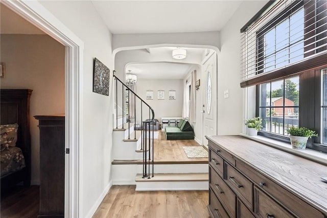 2805 Hamilton Ave, Shaler, PA 15116 - staircase with wood finished floors, arched walkways, and a chandelier