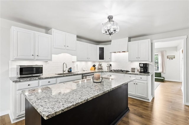 2805 Hamilton Ave, Shaler, PA 15116 - kitchen featuring stainless steel appliances, tasteful backsplash, a chandelier, and white cabinetry
