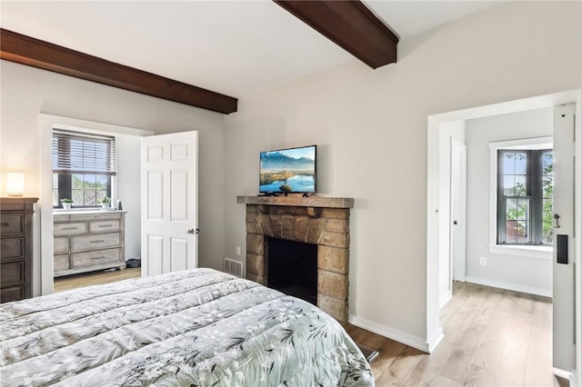 2805 Hamilton Ave, Shaler, PA 15116 - bedroom featuring beamed ceiling, light wood finished floors, and a fireplace