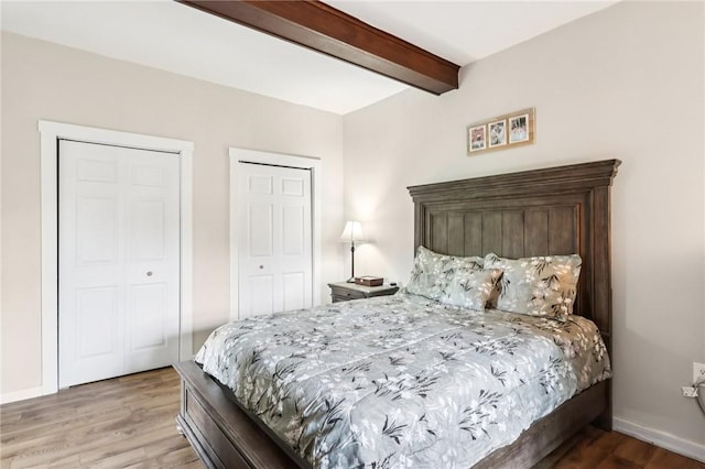 2805 Hamilton Ave, Shaler, PA 15116 - bedroom featuring multiple closets, beamed ceiling, and wood finished floors