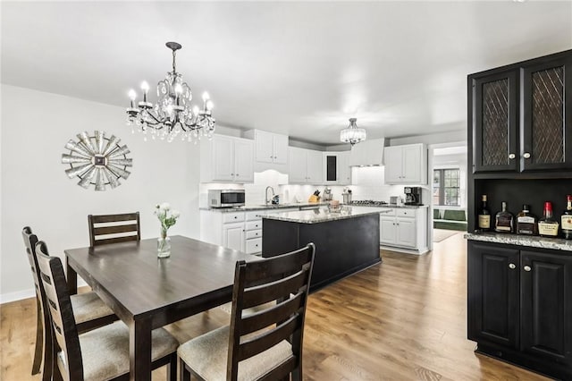 2805 Hamilton Ave, Shaler, PA 15116 - dining space with a chandelier and wood finished floors