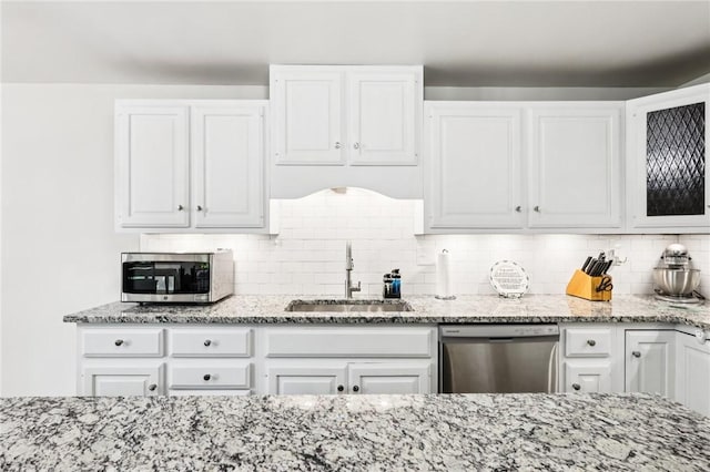 2805 Hamilton Ave, Shaler, PA 15116 - kitchen with stainless steel appliances, light stone counters, white cabinetry, tasteful backsplash, and glass insert cabinets