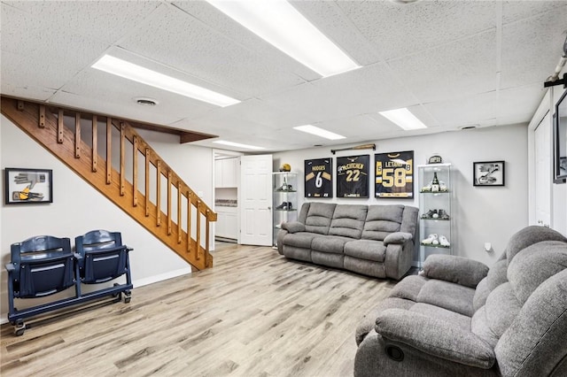 2805 Hamilton Ave, Shaler, PA 15116 - living area with a paneled ceiling, wood finished floors, and stairway