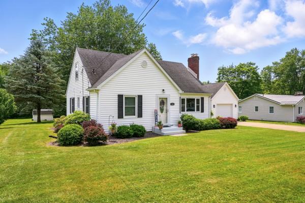 108 E Oakwood Way, Neshannock Twp, PA 16105 - view of front of house with a chimney, concrete driveway, a front lawn, and an attached garage