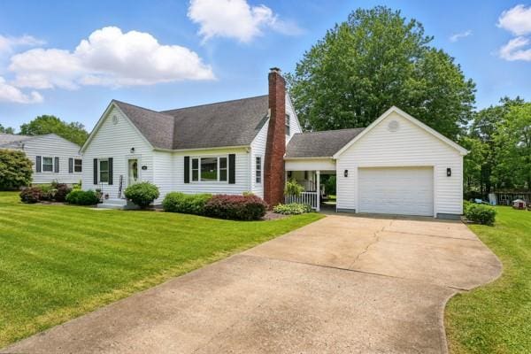 108 E Oakwood Way, Neshannock Twp, PA 16105 - view of front of house with concrete driveway, a front yard, an attached garage, and a chimney