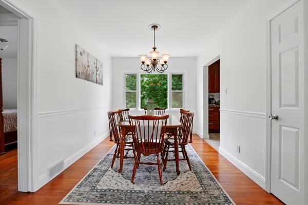 108 E Oakwood Way, Neshannock Twp, PA 16105 - dining space featuring a chandelier and wood finished floors