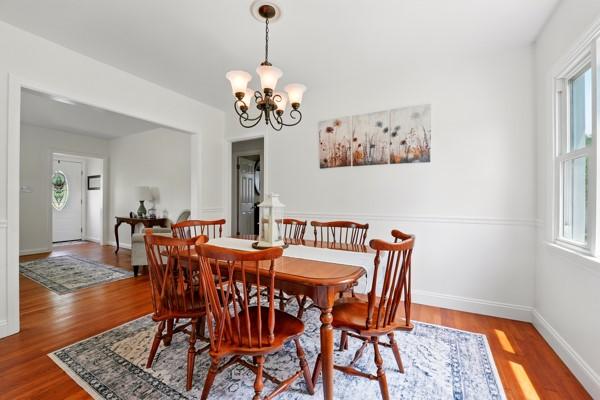 108 E Oakwood Way, Neshannock Twp, PA 16105 - dining area featuring wood finished floors and a chandelier