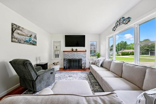 108 E Oakwood Way, Neshannock Twp, PA 16105 - living room featuring wood finished floors and a brick fireplace