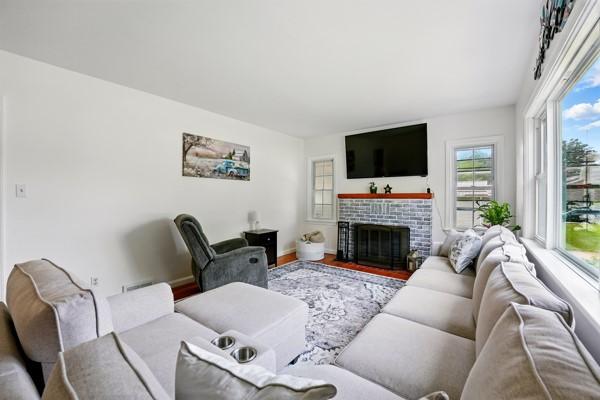 108 E Oakwood Way, Neshannock Twp, PA 16105 - living room featuring a fireplace and wood finished floors