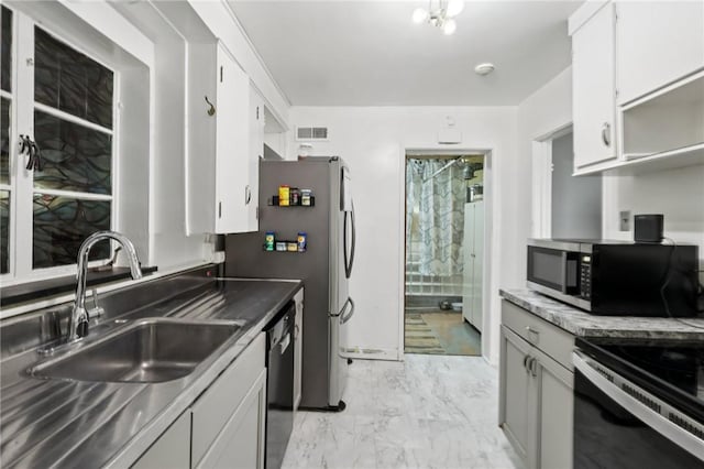 6 Edgewood Acres, Neshannock Twp, PA 16105 - kitchen featuring appliances with stainless steel finishes, light marble finish flooring, and white cabinets