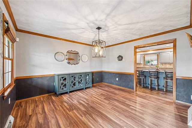 1007 Braemar Dr, Penn Twp Wml, PA 15644 - unfurnished room with wood finished floors, a wainscoted wall, and ornamental molding