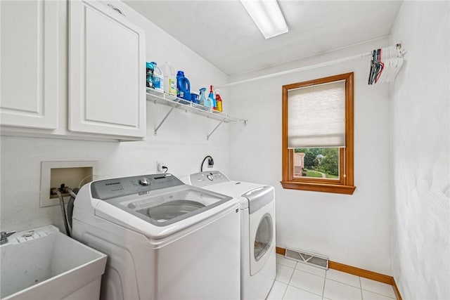 1007 Braemar Dr, Penn Twp Wml, PA 15644 - washroom featuring cabinet space, independent washer and dryer, and light tile patterned flooring