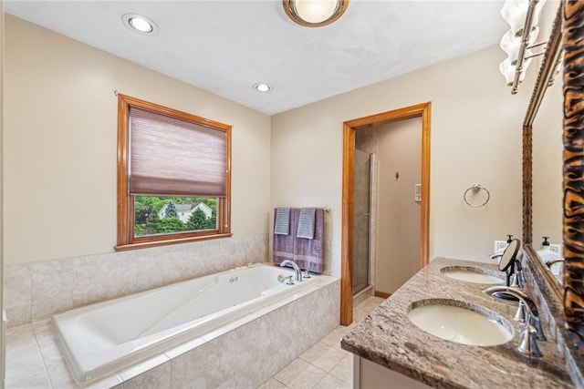 1007 Braemar Dr, Penn Twp Wml, PA 15644 - bathroom with a bath, double vanity, tile patterned flooring, a stall shower, and recessed lighting