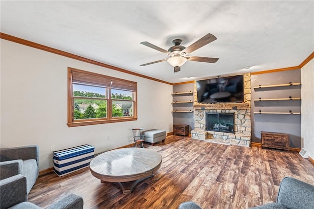 1007 Braemar Dr, Penn Twp Wml, PA 15644 - living area with crown molding, wood finished floors, a ceiling fan, and a fireplace