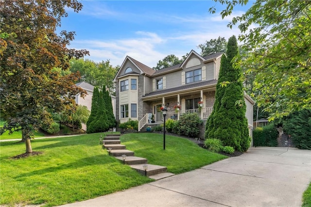 139 Village Dr, Cranberry Twp, PA 16066 - view of front of property with a porch, a front yard, and stone siding