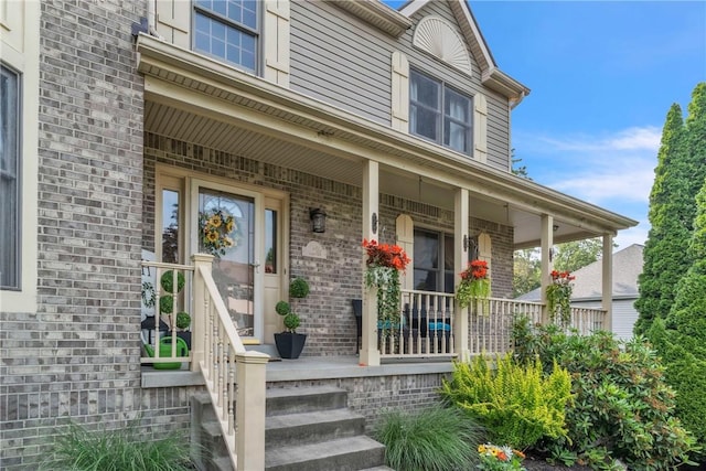 139 Village Dr, Cranberry Twp, PA 16066 - view of exterior entry featuring covered porch and brick siding