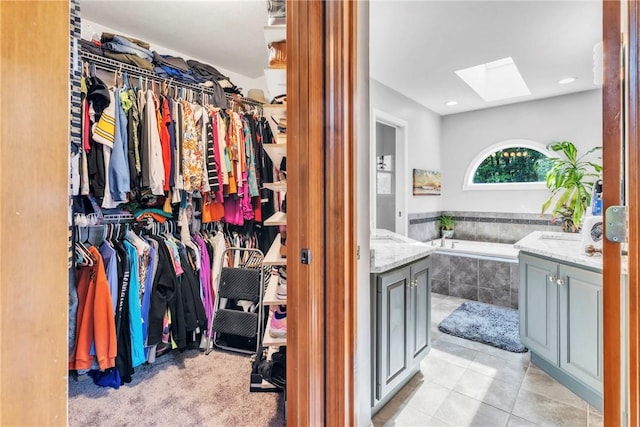 139 Village Dr, Cranberry Twp, PA 16066 - walk in closet featuring a skylight and light tile patterned floors