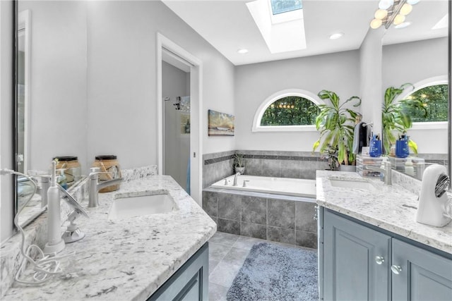 139 Village Dr, Cranberry Twp, PA 16066 - bathroom featuring two vanities, a bath, a skylight, tile patterned floors, and a shower