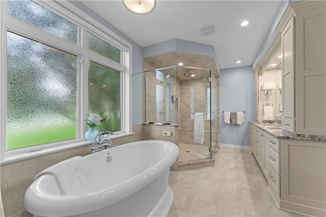 1055 Saint Mellion Dr, Collier Twp, PA 15142 - full bathroom featuring a stall shower, a freestanding tub, vanity, and tile patterned floors