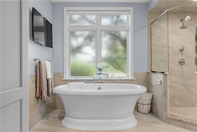 1055 Saint Mellion Dr, Collier Twp, PA 15142 - bathroom featuring tile walls, a tile shower, a soaking tub, plenty of natural light, and a wainscoted wall