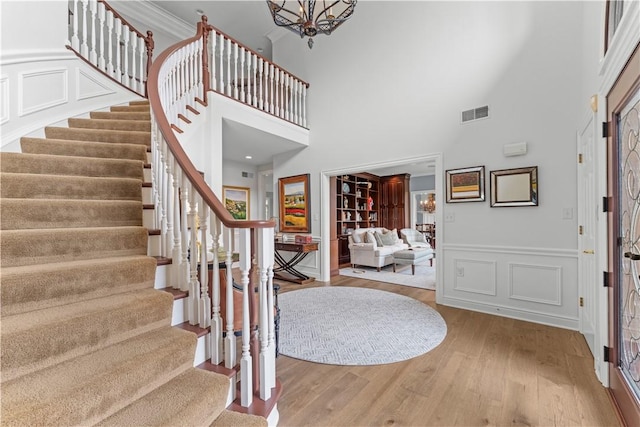 1055 Saint Mellion Dr, Collier Twp, PA 15142 - foyer entrance with stairs, wood finished floors, and a high ceiling