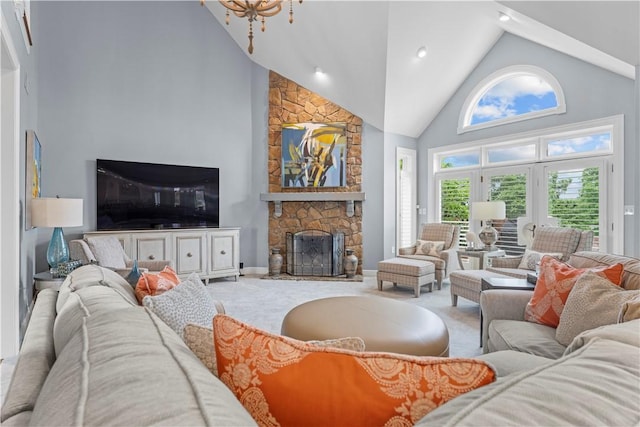 1055 Saint Mellion Dr, Collier Twp, PA 15142 - carpeted living area with high vaulted ceiling, a fireplace, and a chandelier