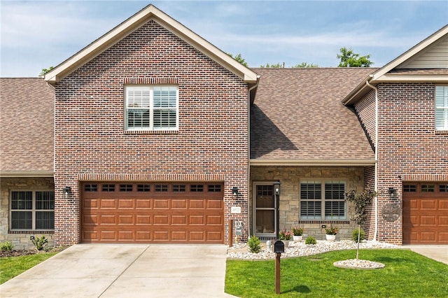 402 Chambers Dr, Canton Twp, PA 15301 - traditional-style home with a shingled roof, brick siding, and concrete driveway
