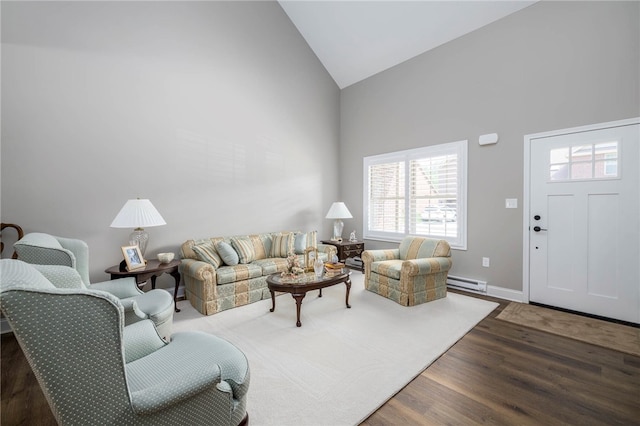 402 Chambers Dr, Canton Twp, PA 15301 - living room featuring high vaulted ceiling, a baseboard heating unit, and wood finished floors