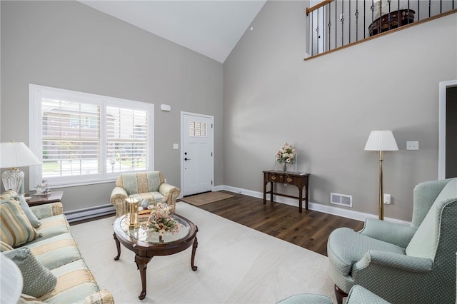 402 Chambers Dr, Canton Twp, PA 15301 - living room featuring high vaulted ceiling, wood finished floors, and baseboard heating