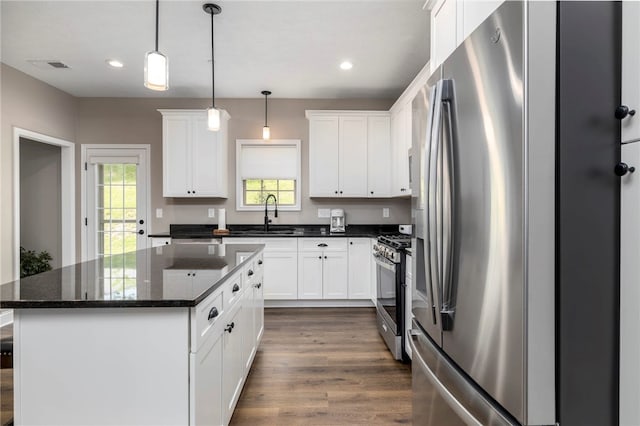 402 Chambers Dr, Canton Twp, PA 15301 - kitchen with appliances with stainless steel finishes, dark wood finished floors, a center island, white cabinets, and recessed lighting