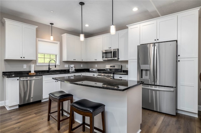 402 Chambers Dr, Canton Twp, PA 15301 - kitchen featuring stainless steel appliances, dark wood-style flooring, white cabinetry, recessed lighting, and a center island