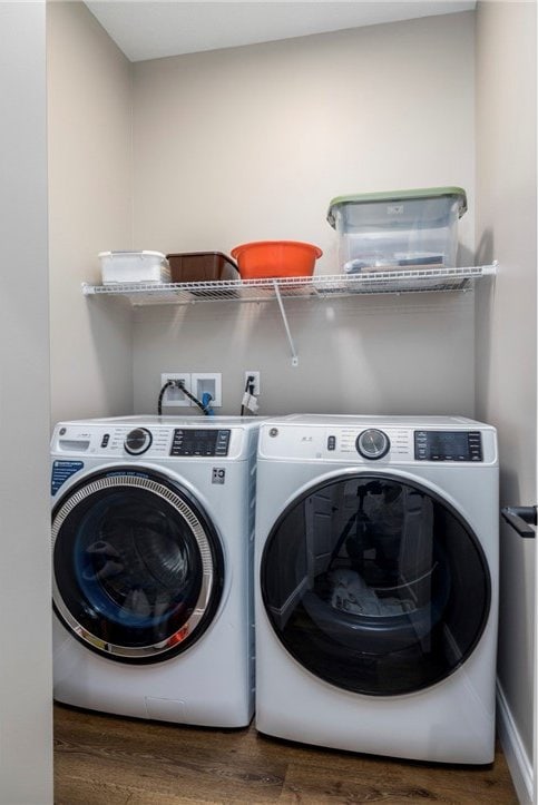 402 Chambers Dr, Canton Twp, PA 15301 - laundry area with wood finished floors and washing machine and dryer
