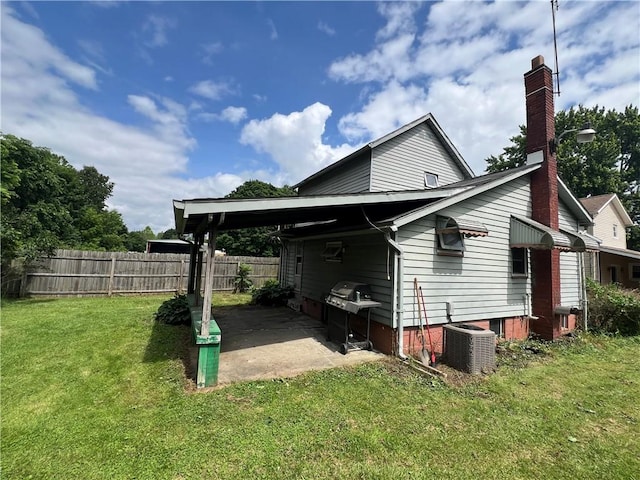 43 N 10th St, Sharpsville, PA 16150 - view of property exterior featuring a chimney and a patio area