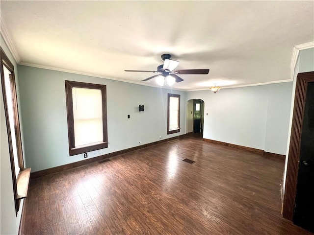 43 N 10th St, Sharpsville, PA 16150 - spare room featuring plenty of natural light, arched walkways, ceiling fan, wood finished floors, and ornamental molding
