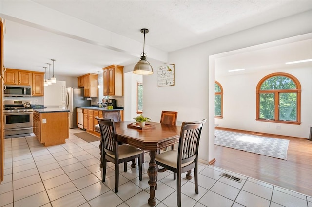 126 Penn Lear Dr, Monroeville, PA 15146 - dining area with light tile patterned floors and baseboards