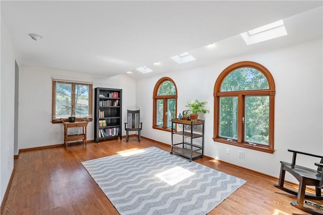 126 Penn Lear Dr, Monroeville, PA 15146 - sitting room with a skylight, healthy amount of natural light, and wood finished floors