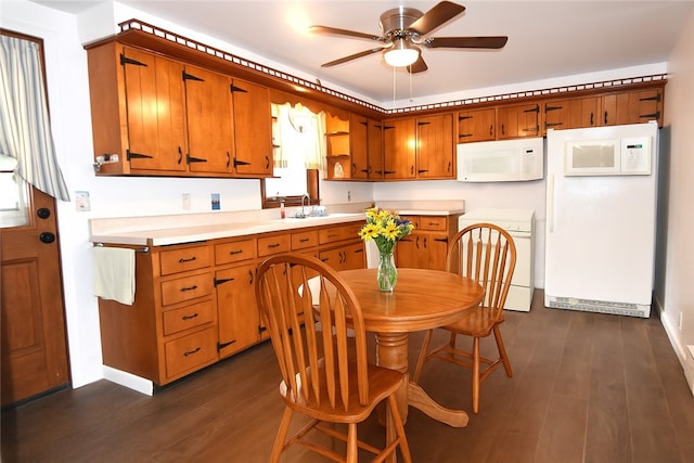 714 Colonial, Coolbaugh Twp, PA 15613 - kitchen with white microwave, stove, refrigerator, a ceiling fan, and dark wood-type flooring