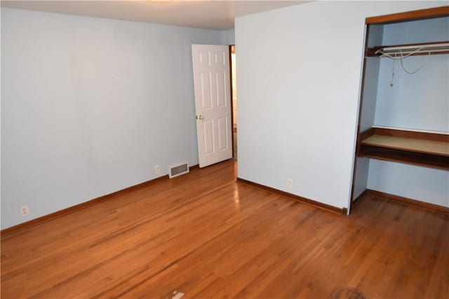 714 Colonial, Coolbaugh Twp, PA 15613 - unfurnished bedroom with wood finished floors and a closet