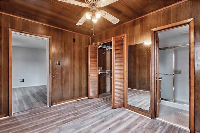 538 Maplewood Ave, Ambridge, PA 15003 - unfurnished bedroom with wood walls, a closet, wood finished floors, wood ceiling, and a ceiling fan