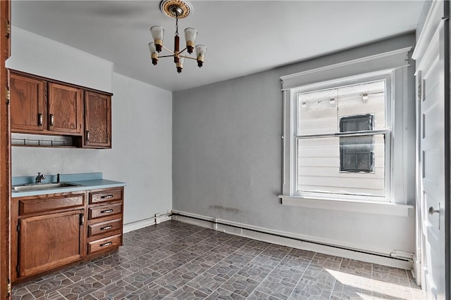 538 Maplewood Ave, Ambridge, PA 15003 - kitchen with a chandelier, a baseboard heating unit, and light countertops