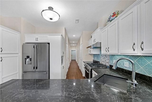 560 Madison Blvd, New Sewickley Twp, PA 15042 - kitchen with appliances with stainless steel finishes, under cabinet range hood, white cabinetry, dark stone counters, and recessed lighting