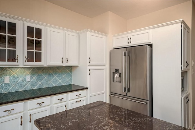 560 Madison Blvd, New Sewickley Twp, PA 15042 - kitchen featuring stainless steel fridge, white cabinetry, glass insert cabinets, decorative backsplash, and dark stone counters