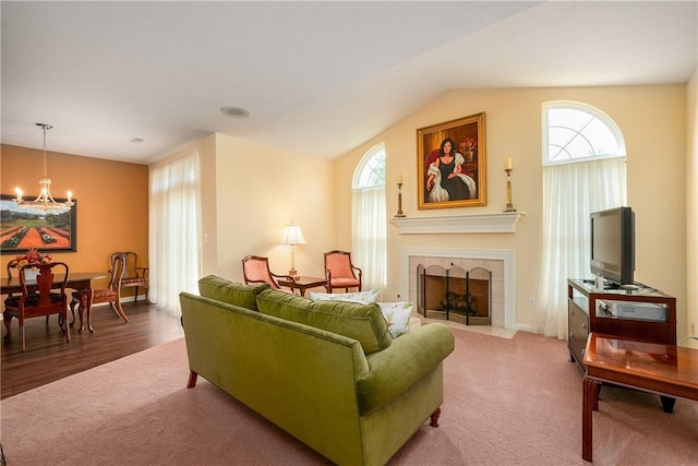 560 Madison Blvd, New Sewickley Twp, PA 15042 - living area with a chandelier, vaulted ceiling, a tile fireplace, and carpet flooring