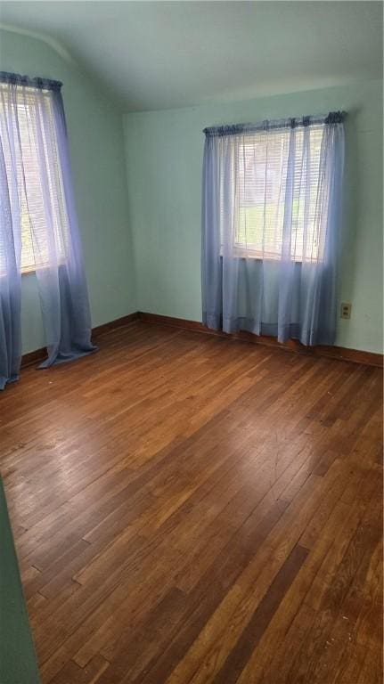 1016 Dallett Rd, Whitehall, PA 15227 - unfurnished room with vaulted ceiling and hardwood / wood-style flooring