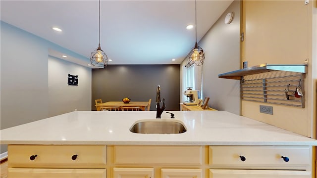 5445 Covode Pl, Squirrel Hill, PA 15217 - kitchen featuring recessed lighting, decorative light fixtures, light stone countertops, and cream cabinets