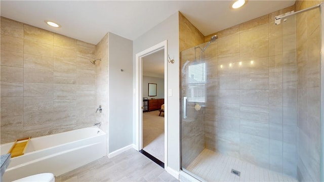 5445 Covode Pl, Squirrel Hill, PA 15217 - bathroom featuring shower / tub combination, recessed lighting, and wood finished floors