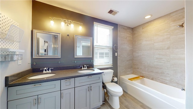 5445 Covode Pl, Squirrel Hill, PA 15217 - full bathroom featuring double vanity, wood finished floors, and bathtub / shower combination