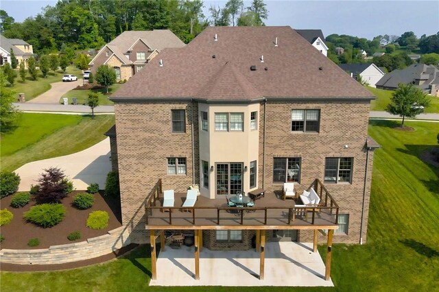 203 Ironwood Ct, Peters Twp, PA 15367 - rear view of property with a patio area, a deck, a yard, and brick siding